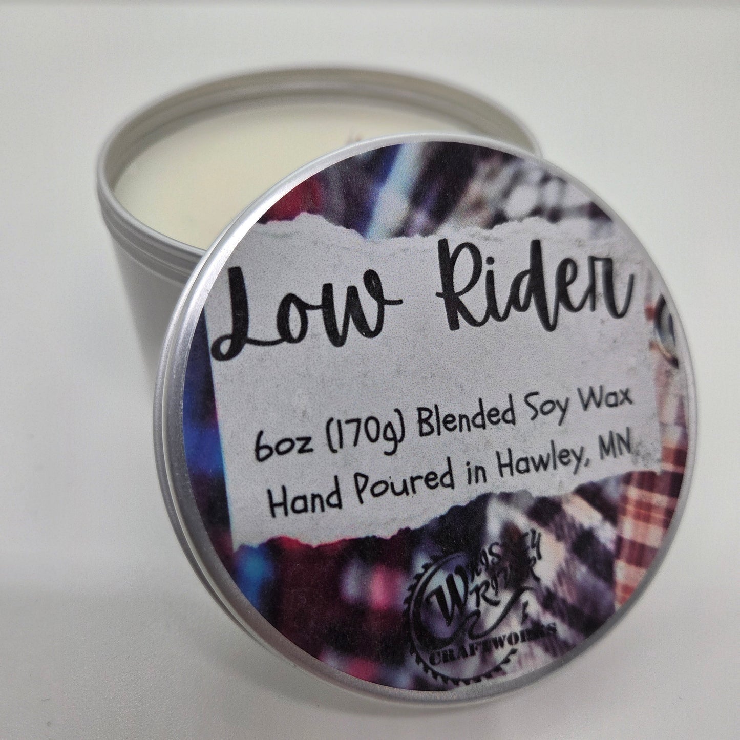 Handcrafted "Low Rider" 6oz soy-blend candle, featuring a cozy flannel scent profile with notes of fresh bergamot, rich mahogany wood, and a soft hint of musk.