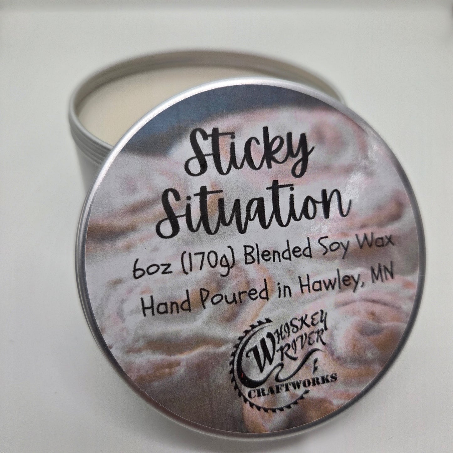 Handcrafted "Sticky Situation" 6oz soy-blend candle, featuring a sweet, warm, and irresistibly indulgent cinnamon roll scent, perfect for creating a cozy kitchen atmosphere.