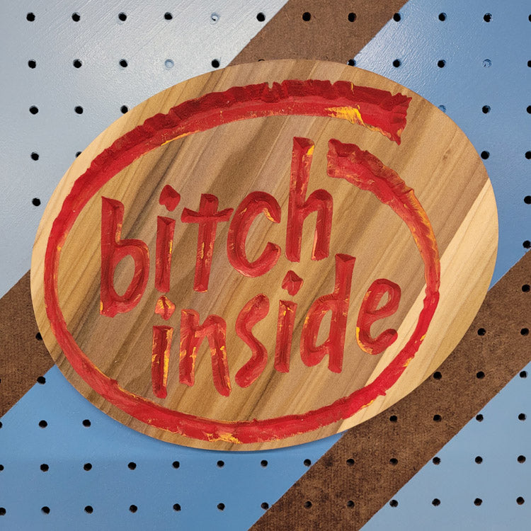 Handcrafted relief-carved hardwood sign featuring a design inspired by the Intel logo, with the text "Bitch Inside."