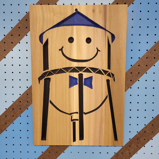 Relief carved hardwood sign featuring the iconic Grand Forks smiley water tower design with blue and black painted accents.