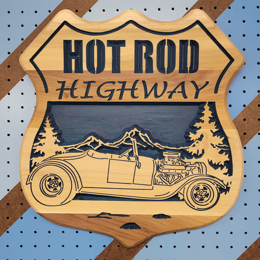 Fully customizable relief carved hardwood shield-shaped sign featuring a vintage hot rod convertible, pine trees, and Hot Rod Highway text.