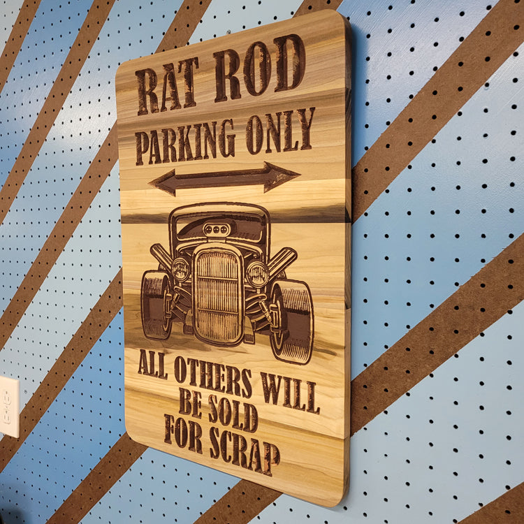 Close-up of the clean finish and natural wood grain on a personalized rat rod garage sign.