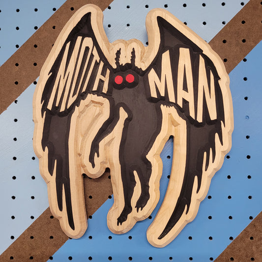 Relief carved hardwood sign with a detailed Mothman cryptid design on a white background.