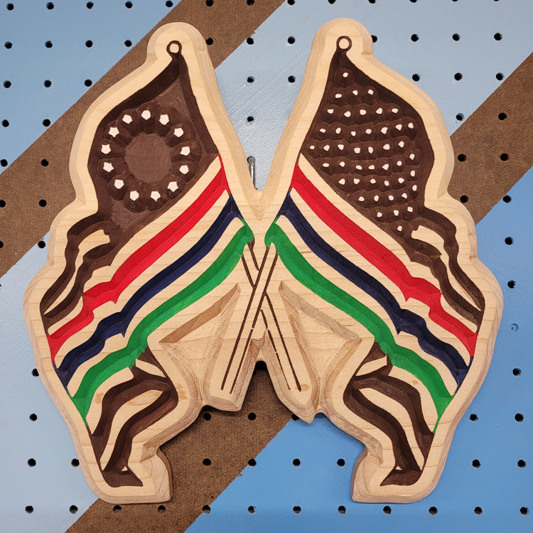 Custom CNC-carved wooden wall art featuring two stylized flag designs joined together.