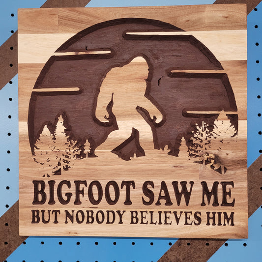 Handcrafted relief-carved hardwood sign featuring a Bigfoot silhouette and the text "BIGFOOT SAW ME BUT NOBODY BELIEVES HIM."