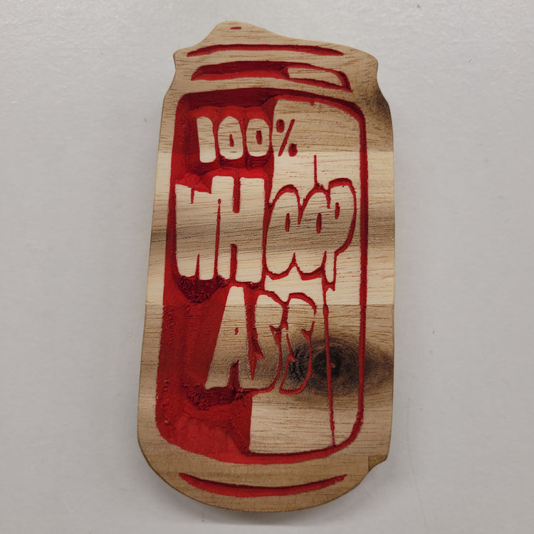 Custom hardwood sign carved into a soda can shape featuring a 100% Whoop Ass red relief design.
