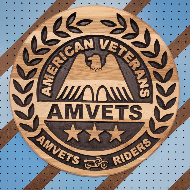 Custom CNC-carved wooden circular plaque featuring an eagle emblem, laurel wreath detailing, and text related to veteran motorcyclists