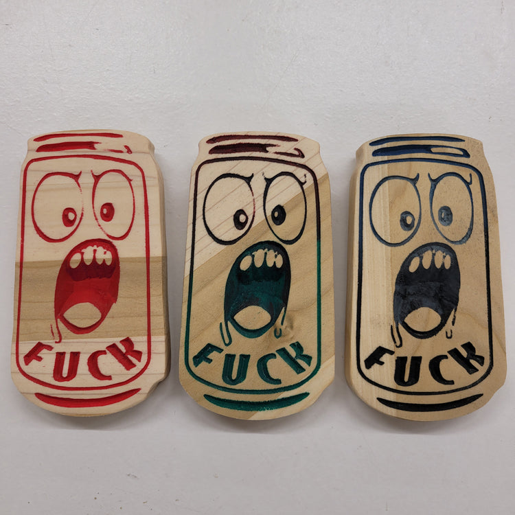 Three relief carved hardwood can-shaped signs with screaming cartoon faces and the text FUCK on a white background