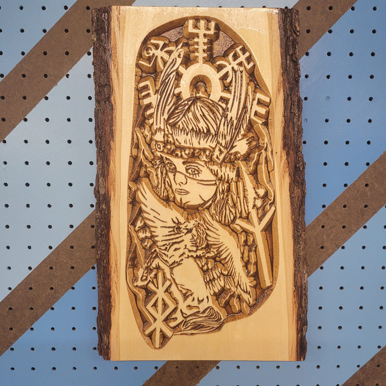 Custom CNC-carved live-edge wooden plaque featuring an intricate design of a Norse-inspired female warrior figure with traditional symbols, originally adapted from a tattoo design.