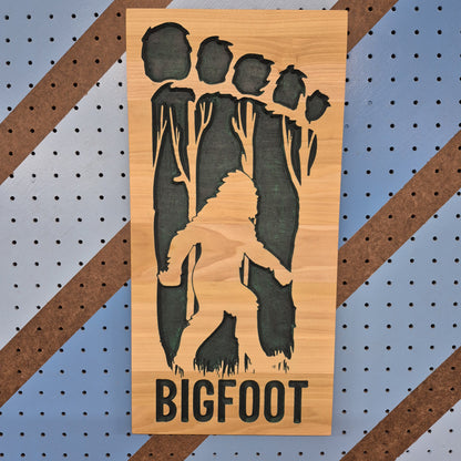 Handcrafted relief-carved hardwood "Big Foot" silhouette sign, precision-cut and hand-finished for high-quality, cryptid-themed wall decor.