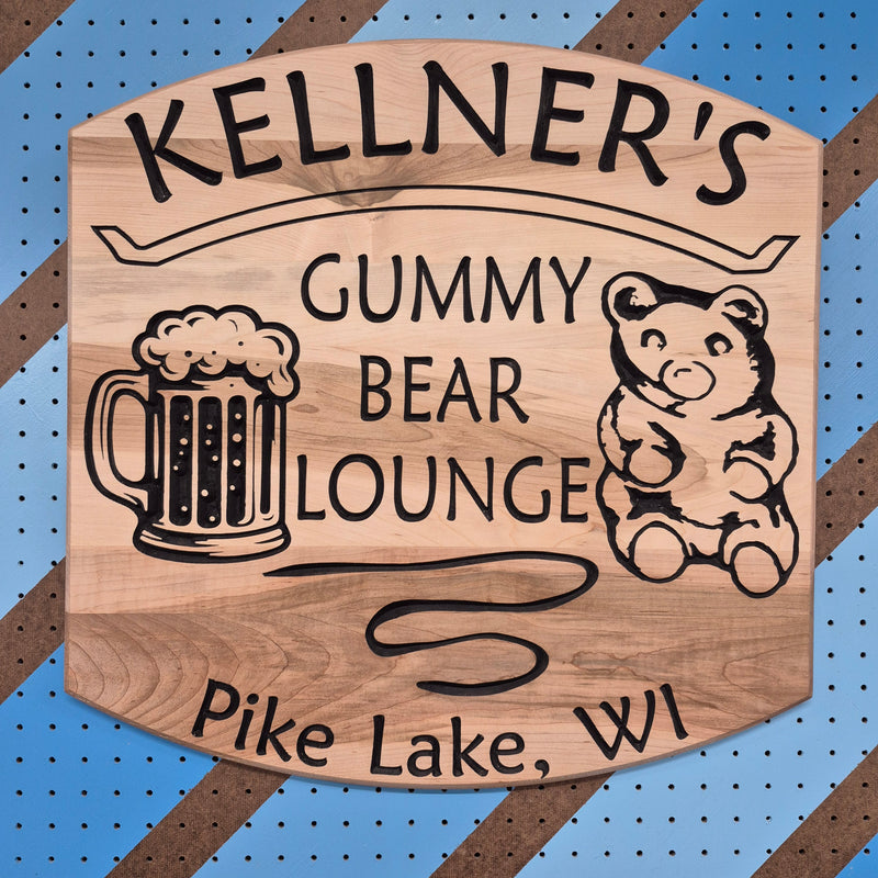 Custom CNC-carved wooden sign featuring a bear and beer mug illustration with 'Gummy Bear Lounge' text, handcrafted and finished by Whiskey River Craftworks
