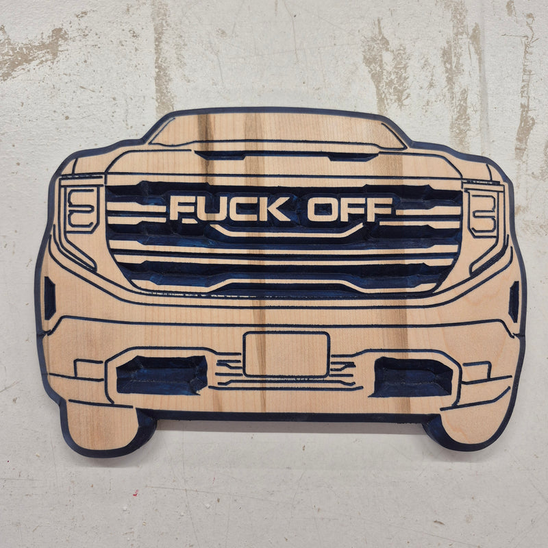 Custom CNC-carved wooden sign shaped like a truck front grille, featuring the text 'FUCK OFF' across the center
