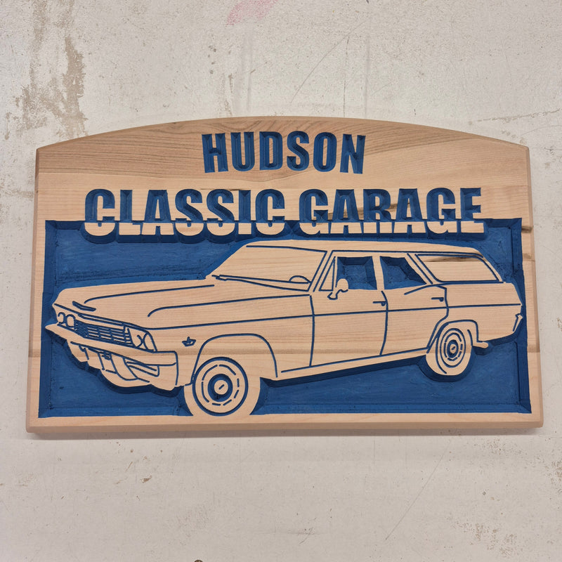 Custom CNC-carved wooden sign featuring a vintage station wagon vehicle illustration and the text 'Hudson Classic Garage'