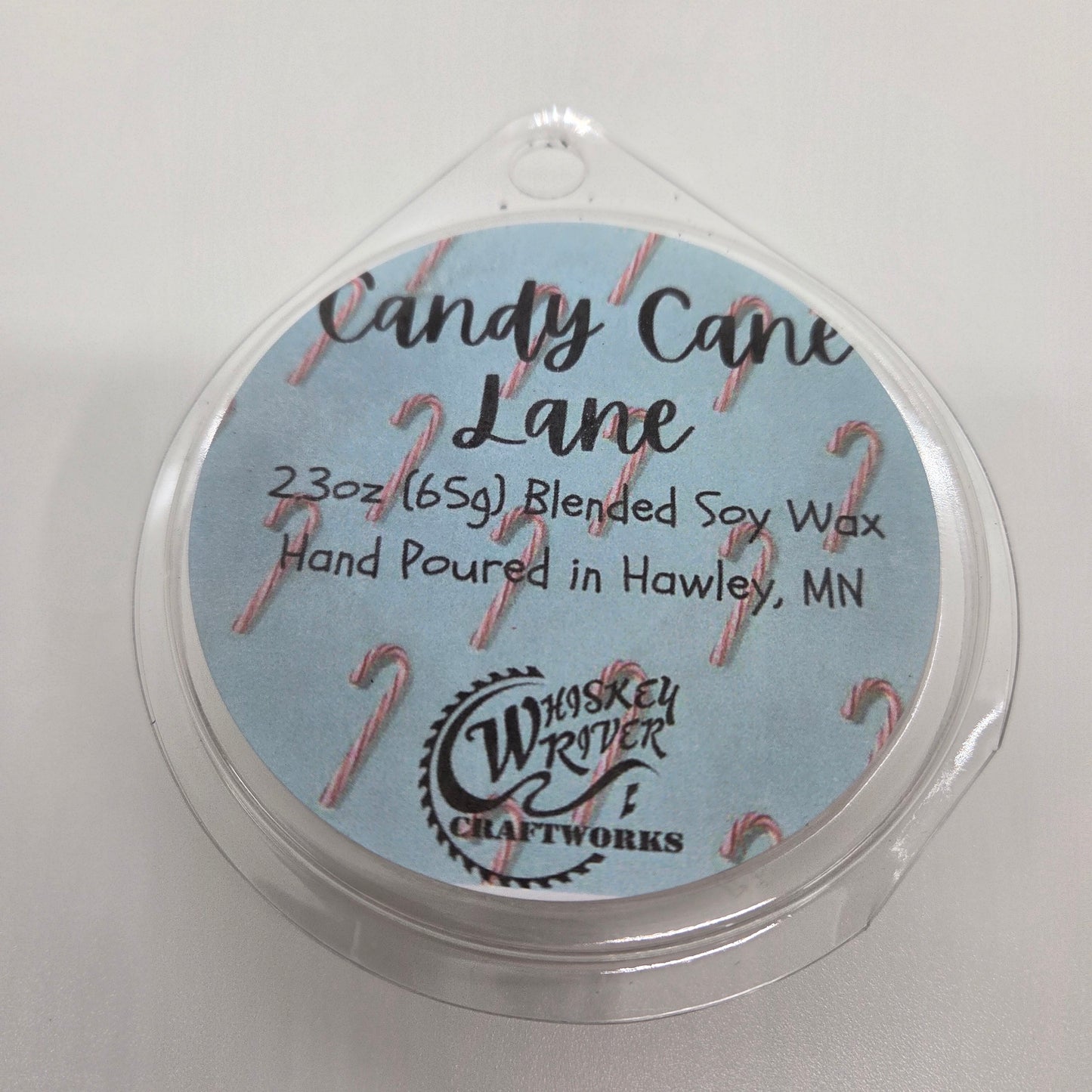 Wax Melts variant in Candy Cane Lane featuring a festive holiday-themed custom fragrance label on a clear clamshell pack.