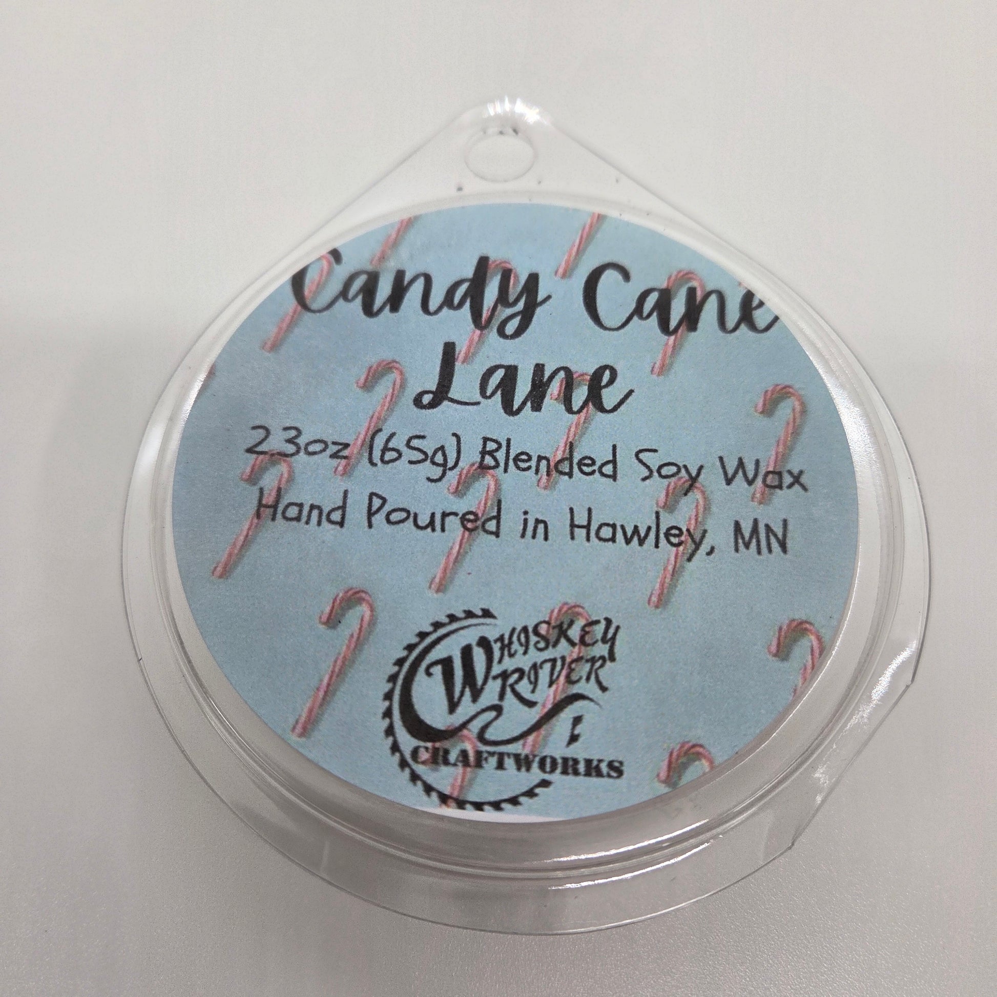 Wax Melts variant in Candy Cane Lane featuring a festive holiday-themed custom fragrance label on a clear clamshell pack.