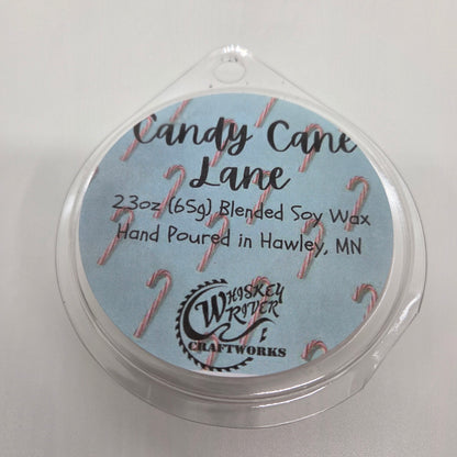 Wax Melts variant in Candy Cane Lane featuring a festive holiday-themed custom fragrance label on a clear clamshell pack.