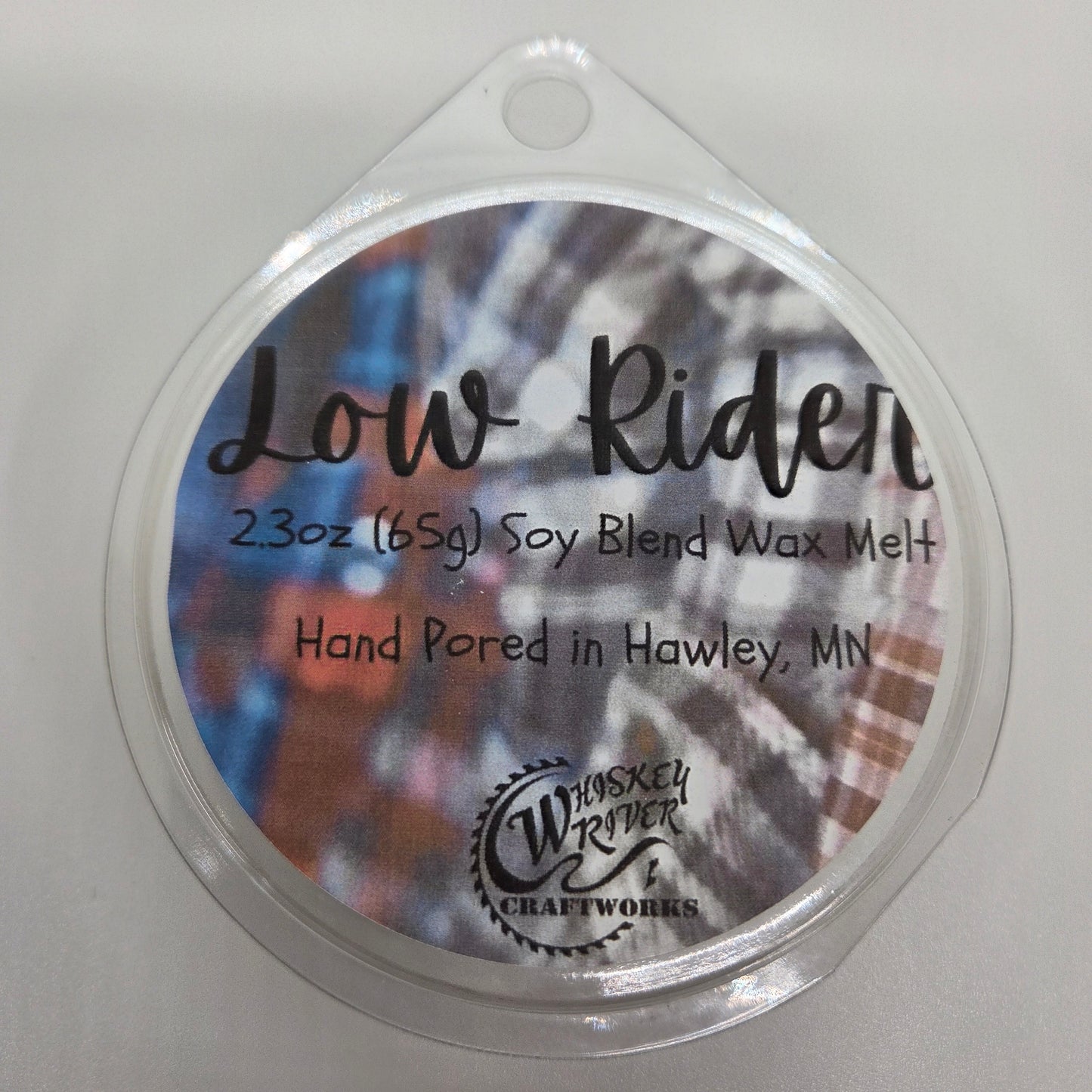 Wax Melts variant in Low Rider featuring a custom plaid and script automotive-style fragrance label on a clear clamshell pack.