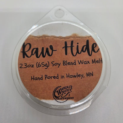 Wax Melts variant in Raw Hide featuring a distressed, brown leather-style custom fragrance label on a clear clamshell pack