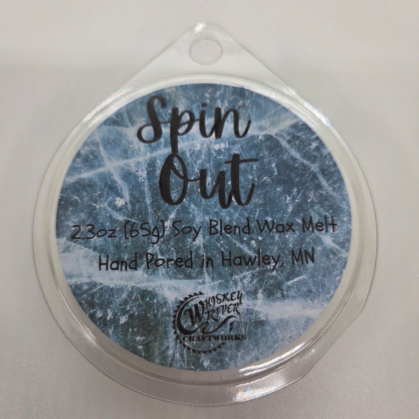 Wax Melts variant in Spin Out featuring a textured blue and white custom automotive-themed fragrance label on a clear clamshell pack.