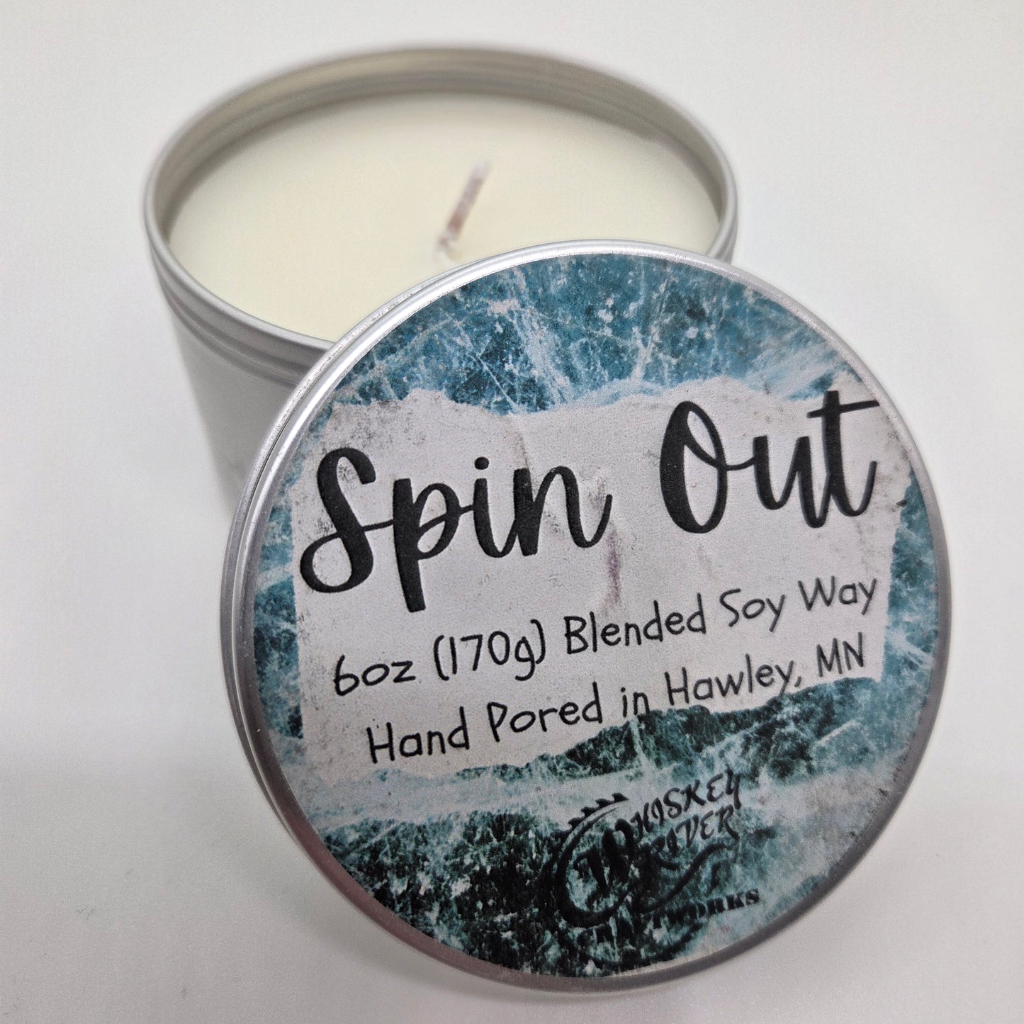 Handcrafted "Spin Out" 6oz soy-blend candle, featuring a crisp, masculine "Black Ice" inspired scent, perfect for gearheads and man cave decor.