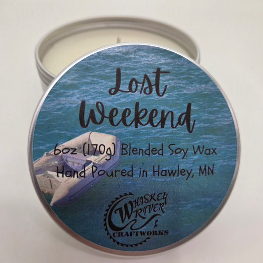 Handcrafted "Lost Weekend" 6oz soy-blend candle, featuring a fresh, crisp, and calming scent of eucalyptus and salty sea salt, designed to evoke the feeling of a quiet, stress-free morning by the ocean.