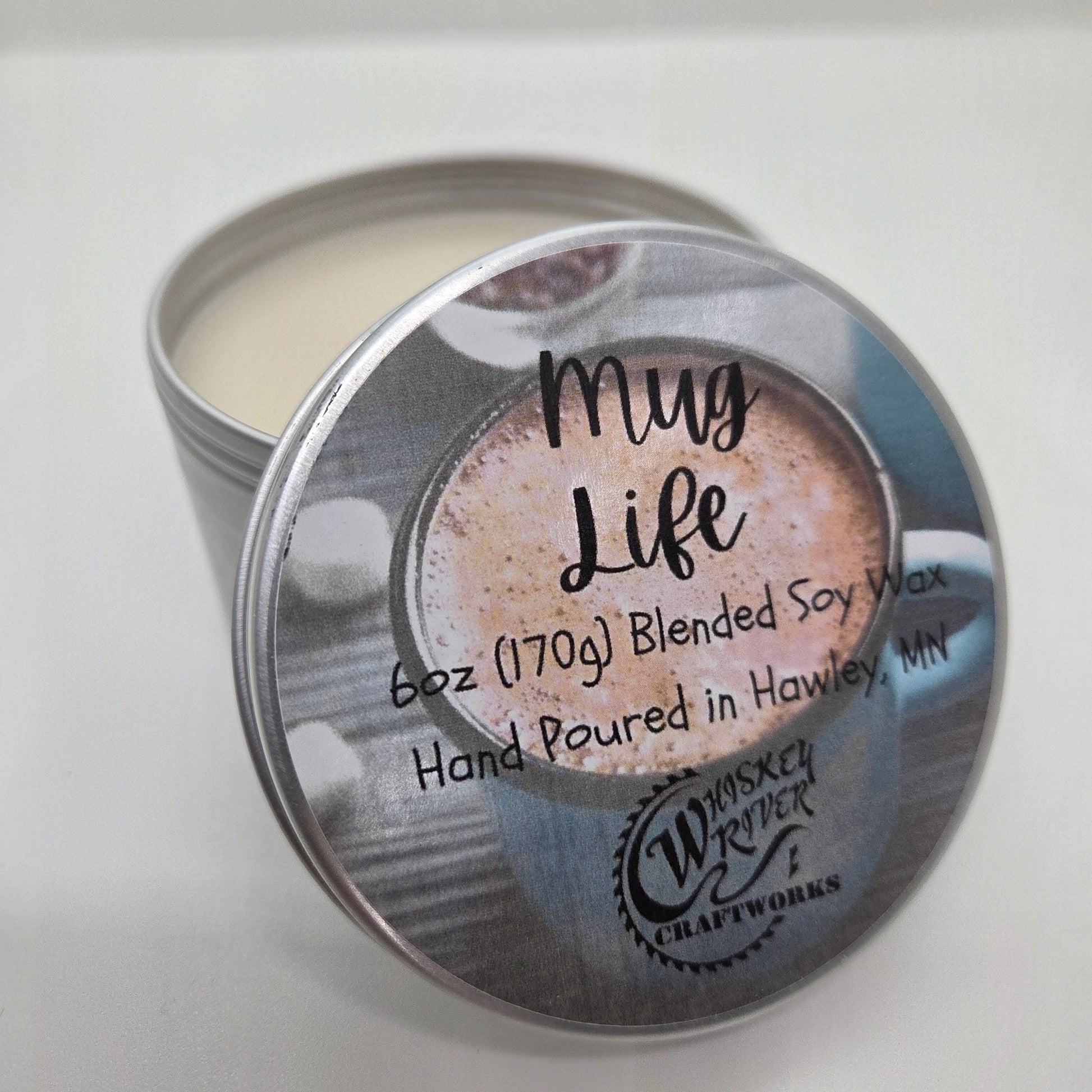 Handcrafted "Mug Life" 6oz soy-blend candle, featuring a rich, warm, and decadent hot cocoa scent designed to evoke the comfort of a cozy winter day at home.
