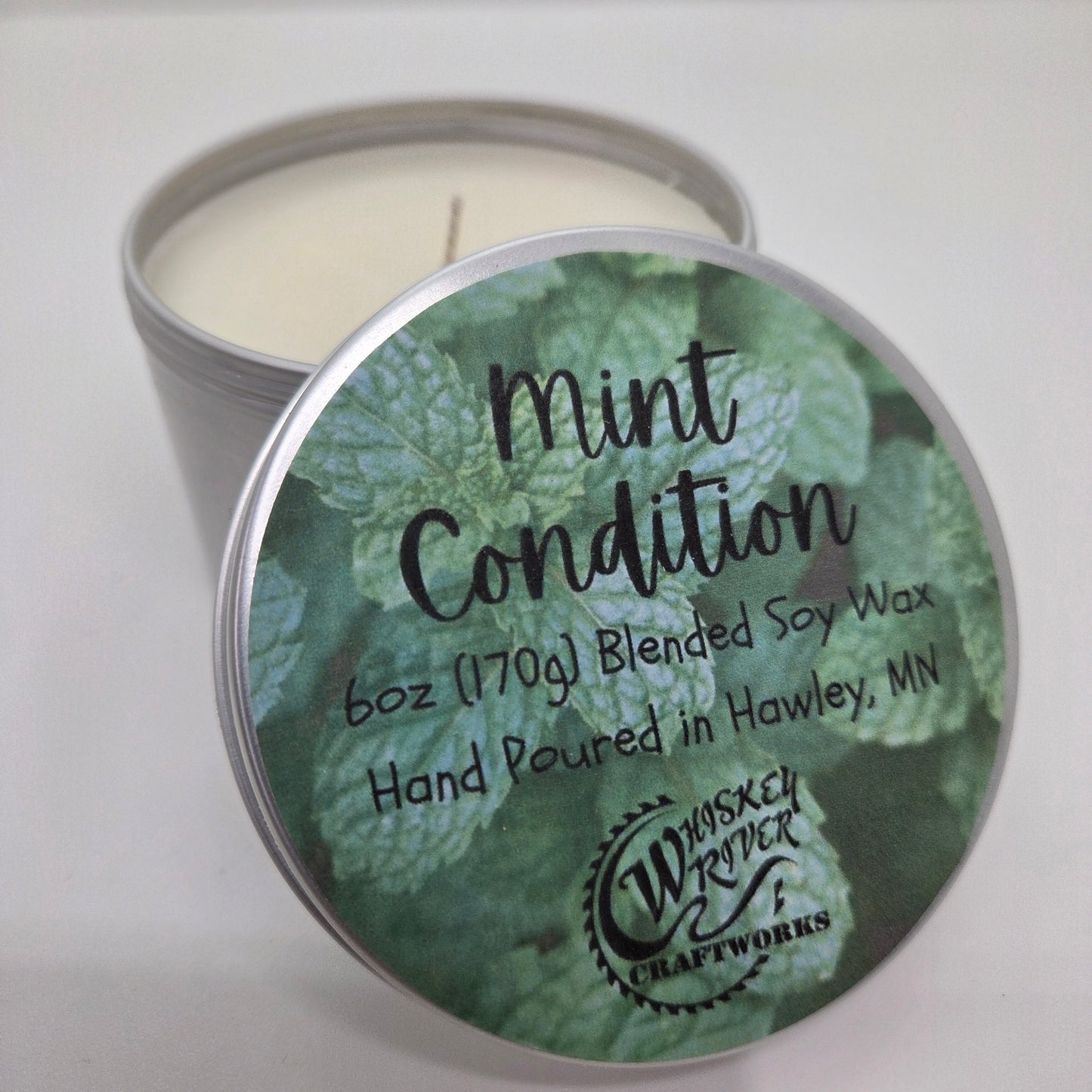 Handcrafted "Mint Condition" 6oz soy-blend candle, featuring a cooling, refreshing blend of mint and eucalyptus, perfect for a spa-like atmosphere at home.