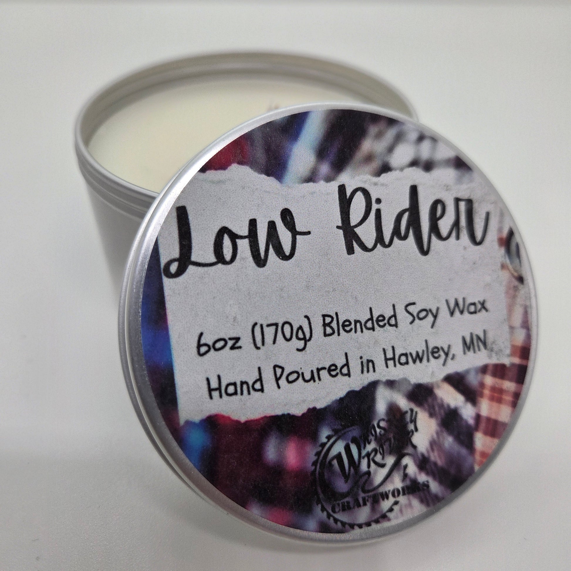 Handcrafted "Low Rider" 6oz soy-blend candle, featuring a cozy flannel scent profile with notes of fresh bergamot, rich mahogany wood, and a soft hint of musk.