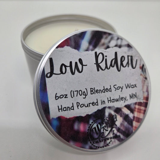 Handcrafted "Low Rider" 6oz soy-blend candle, featuring a cozy flannel scent profile with notes of fresh bergamot, rich mahogany wood, and a soft hint of musk.