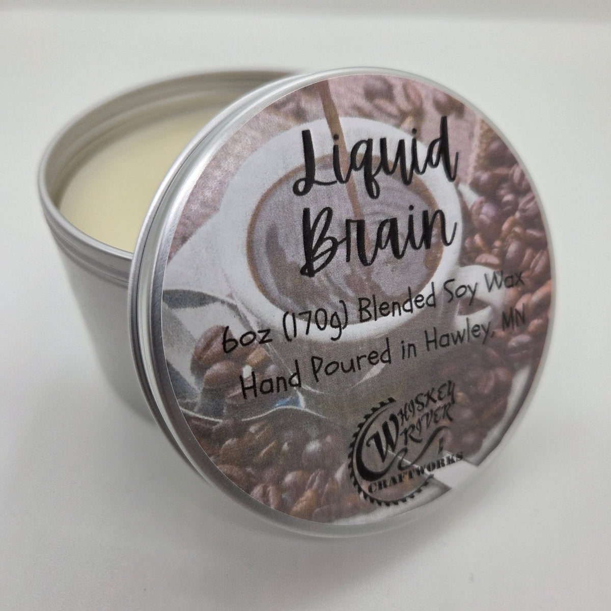 Handcrafted "Liquid Brain" 6oz soy-blend candle, featuring a bold, dark roast coffee scent designed to provide a productive, caffeine-inspired boost to your day.