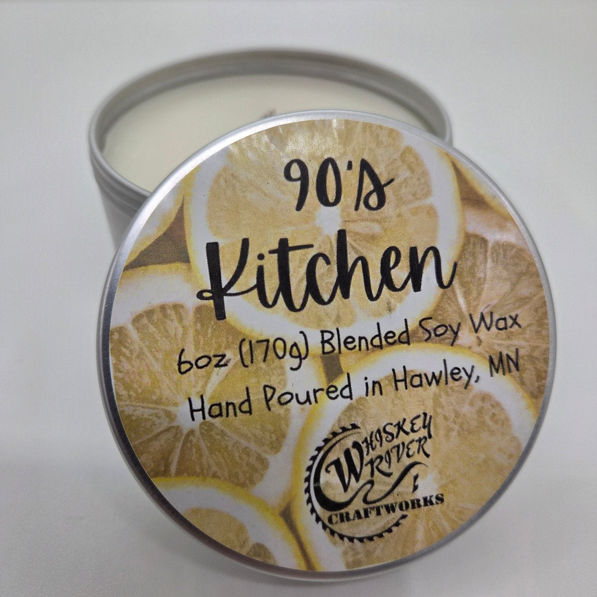 90's Kitchen 6 oz soy-blend candle in silver tin with lemon-patterned label