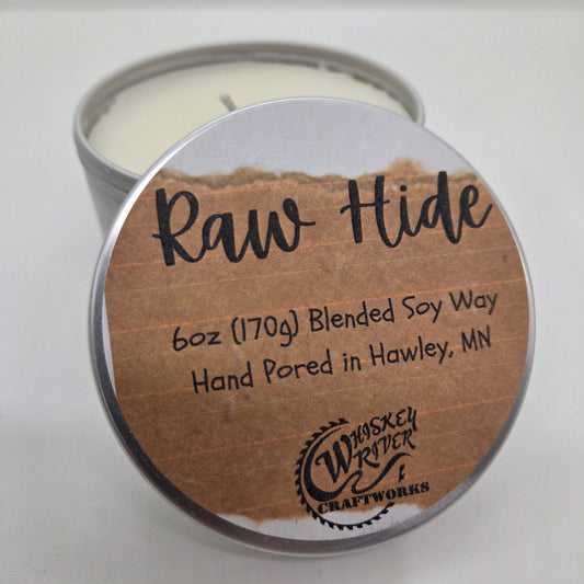 Handcrafted "Raw Hide" 6oz soy-blend candle, featuring a bold, premium leather scent that captures the authentic aroma of a traditional workshop.