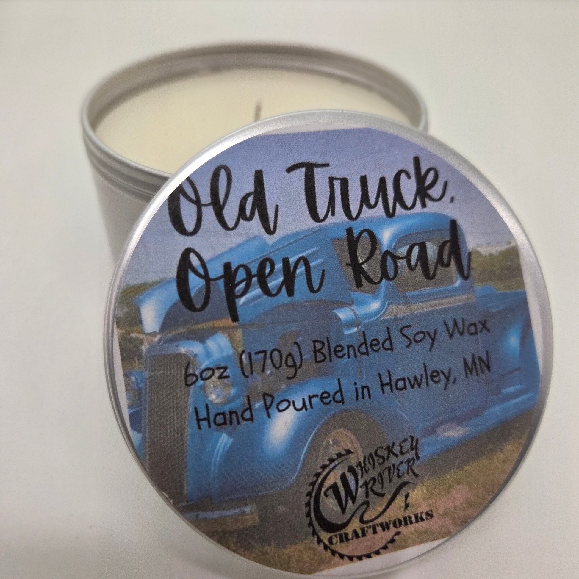 Handcrafted "Old Truck, Open Road" 6oz soy-blend candle, featuring a rugged, masculine blend of aged leather, patchouli, rosewood, and a hint of bergamot for an adventurous, open-highway scent.
