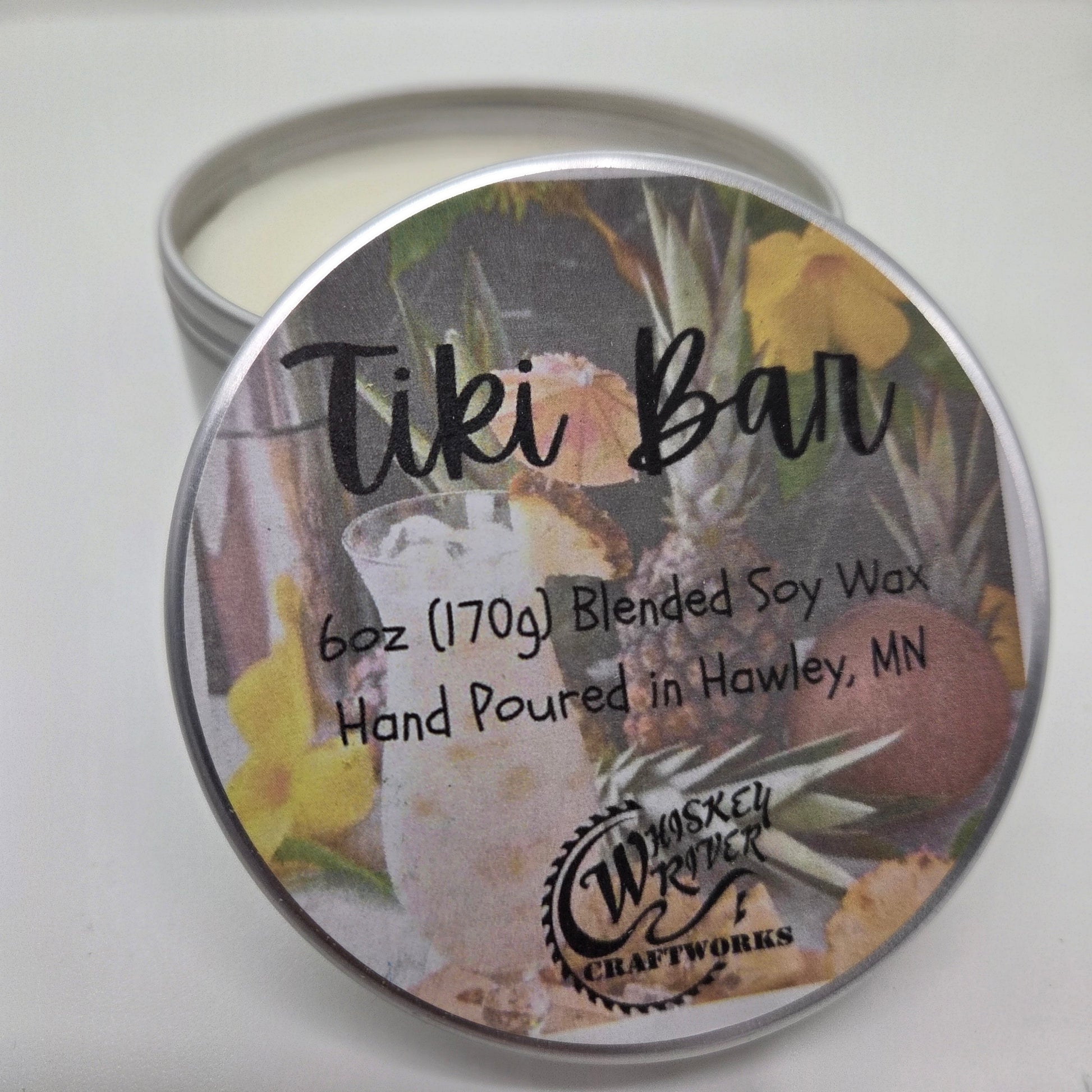 Tiki Bar 6oz Soy Blend Candle variant featuring a custom retro tropical cocktail and floral fragrance label on a metal tin lid.