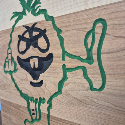 Close-up of the carved details and natural wood grain on a novelty middle finger shop sign.