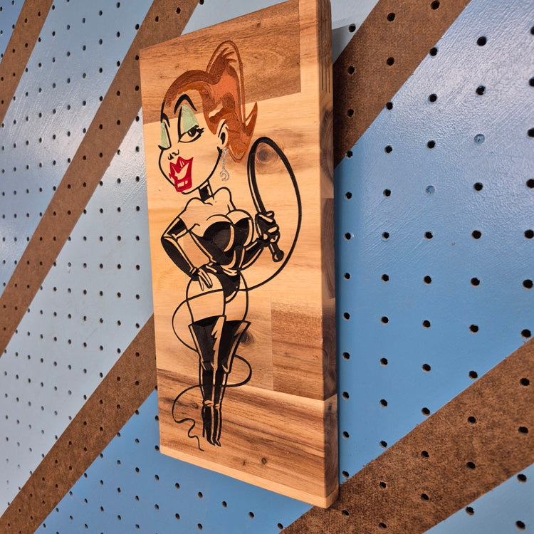 Edgy Dominatrix wooden wall sign displayed as home bar and garage man cave decor.
