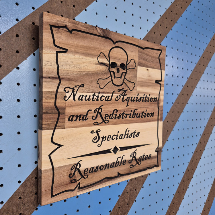 n angled side shot of the custom carved Nautical Acquisition wooden plaque, showcasing the clean CNC relief work and the rich, natural patterns of the hardwood grain.