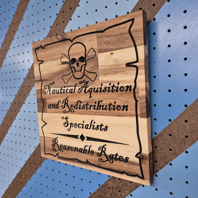 A perspective view from the opposite angle of the pirate-themed wooden sign, highlighting the deep, crisp engraving and the smooth, professional finish.