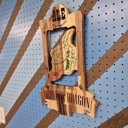 A perspective view from the opposite angle of the dragon-themed tavern sign, showcasing the crisp engraving, smooth edges, and professional satin finish.