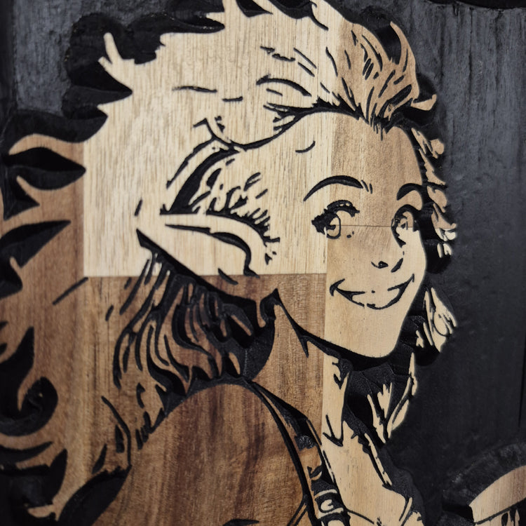 A tight close-up shot of the custom wood carving, highlighting the precise CNC-machined details and crisp hand-painted black accents in the girl gnome's flowing hair, eyes, and mischievous smile, showcasing the smooth texture and natural grain of the hardwood.