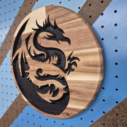 A perspective view from the opposite angle of the custom carved dragon sign, showcasing the clean, smooth outer circle edge and the professional finish of the premium hardwood.