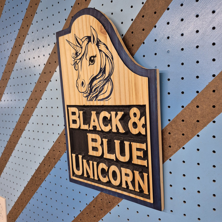 A perspective view from the opposite angle of the unicorn fantasy sign, highlighting the clean, vertical outer edges, smooth borders, and the professional satin finish of the premium hardwood.