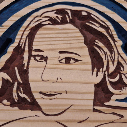 A tight close-up shot focusing on the barmaid's face and expressive carving details, highlighting the incredibly crisp CNC lines and precise hand-painted accents filling the background cuts.