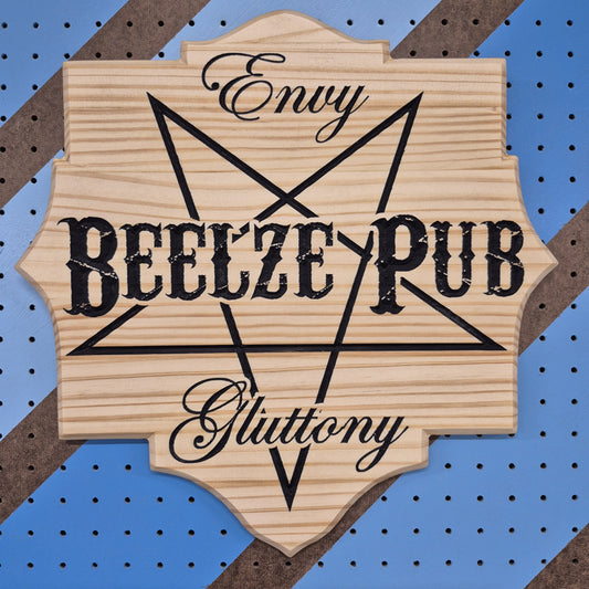 A square solid hardwood carved tavern sign featuring an inverted pentagram with the text "Envy", "BEELZE PUB", and "Gluttony". The carving features crisp hand-painted black accents against a blue and brown striped pegboard.