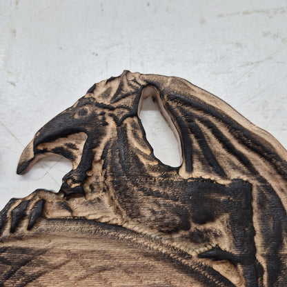 A tight close-up shot focusing on the left dragon's head and wing, highlighting the incredibly crisp CNC carving lines, the natural wood grain, and the precise accents.