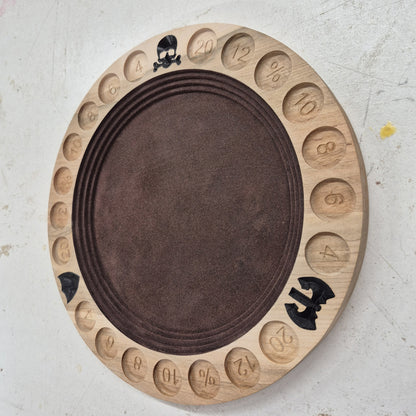 An angled side perspective of the circular Gladiator wooden dice tray, showcasing the clean depth of the flat CNC relief cuts and the rich patterns of the natural hardwood grain.