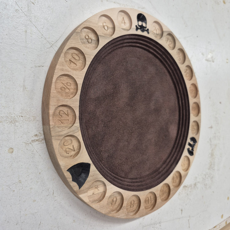 A perspective view from the opposite angle of the carved gladiator tray, highlighting the smooth outer rim and the seamless transition to the dark brown flocked interior rolling surface.
