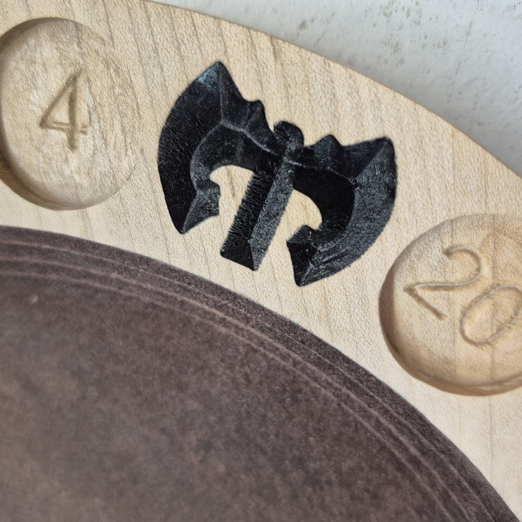 A tight close-up shot focusing on the carved double-bitted battle axe on the tray's border, highlighting the incredibly crisp CNC machining and the precise hand-painted dark brown details filling the cuts.