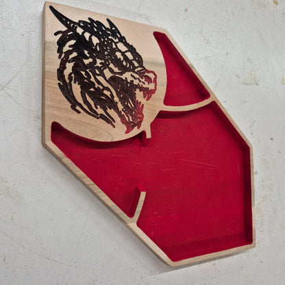 An angled side perspective of the Dragon Head wooden dice tray, highlighting the clean depth of the flat CNC relief cuts and the rich patterns of the natural hardwood grain.