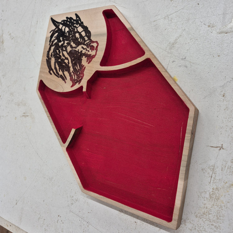 A perspective view from the opposite angle of the carved fantasy tray, showcasing the unique outer rim angles and the seamless transition to the red flocked interior rolling surface.